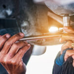 Hand,Mechanic,In,Repairing,Car,change,The,Oil